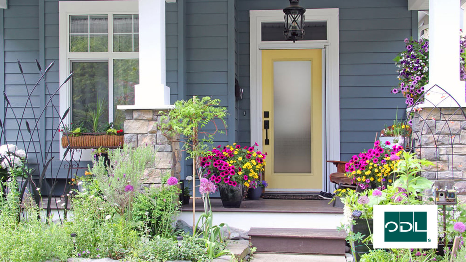 A door on a house with flowers and the ODL logo
