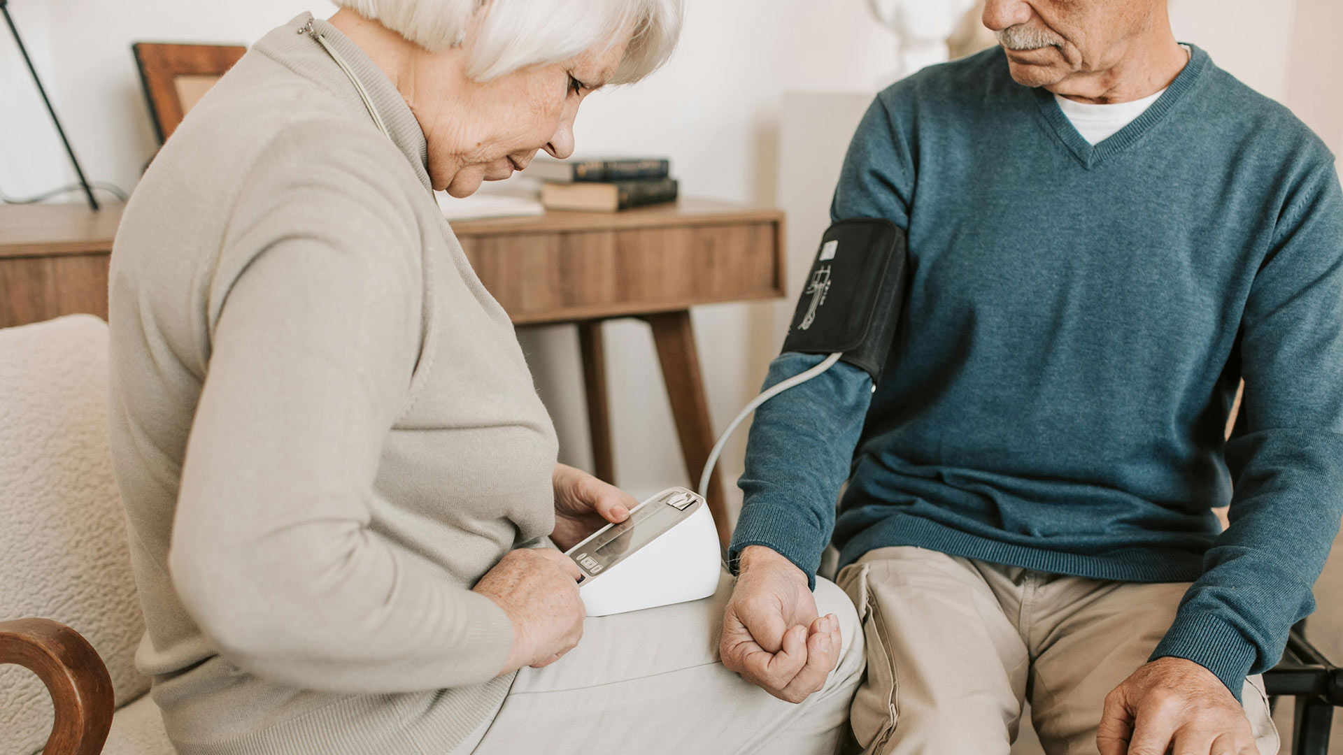 Seniors testing blood pressure