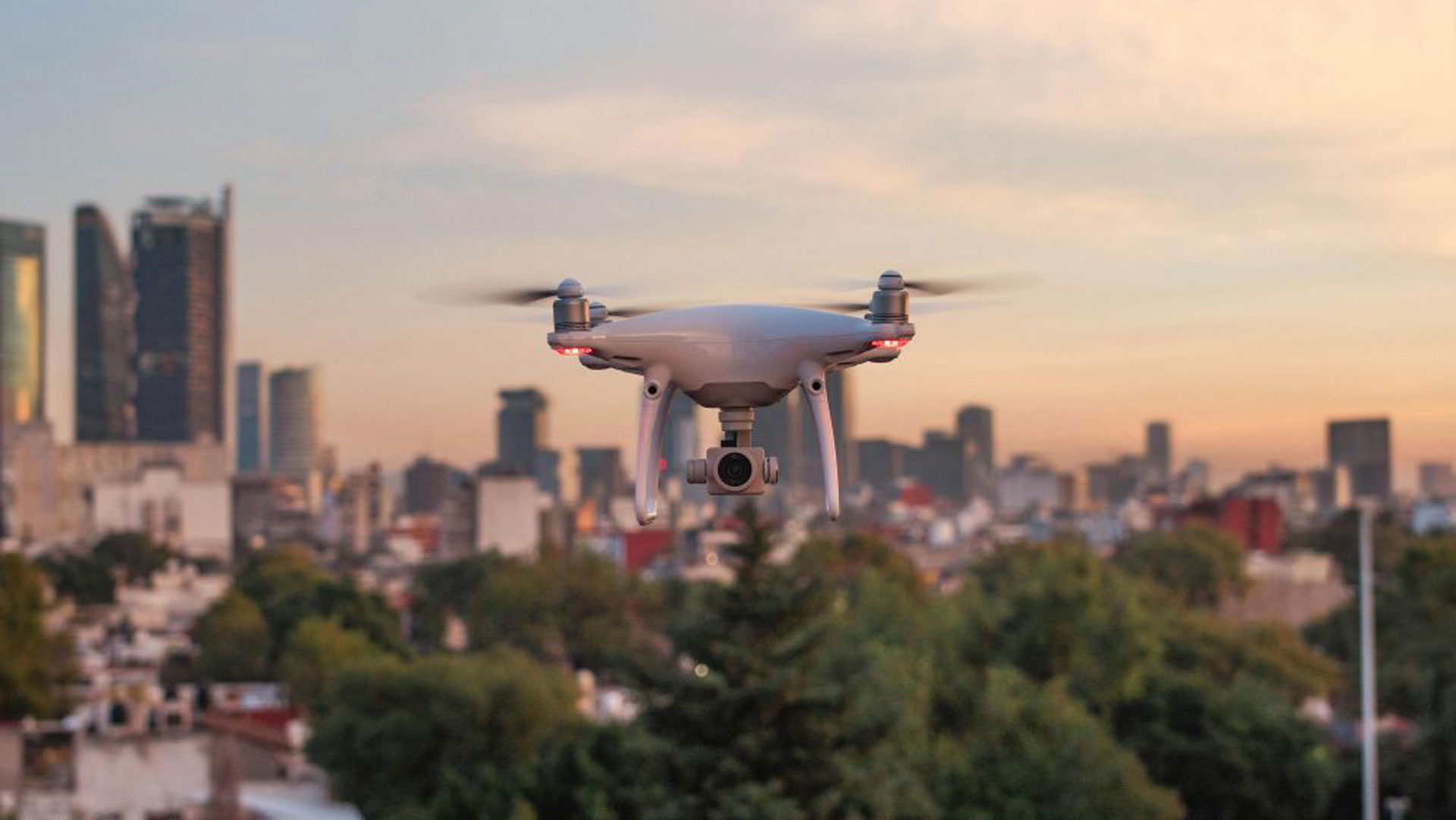 Drone flying with cityscape in background