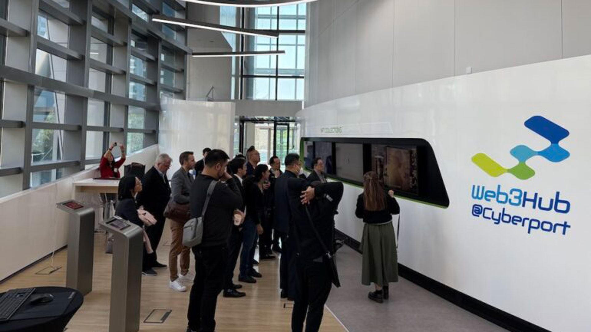 People looking at a web3hub cyberport